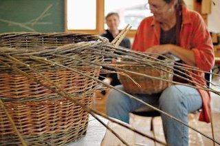 Woman weaving a large basket
