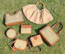 handmade purses and baskets on the grass